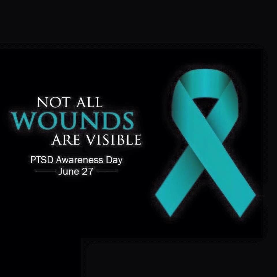 A blue ribbon with the words " not all wounds are visible ".